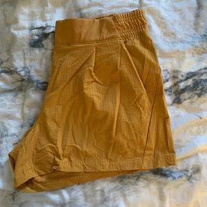 Athleta textured mustard colored shorts. Size 12